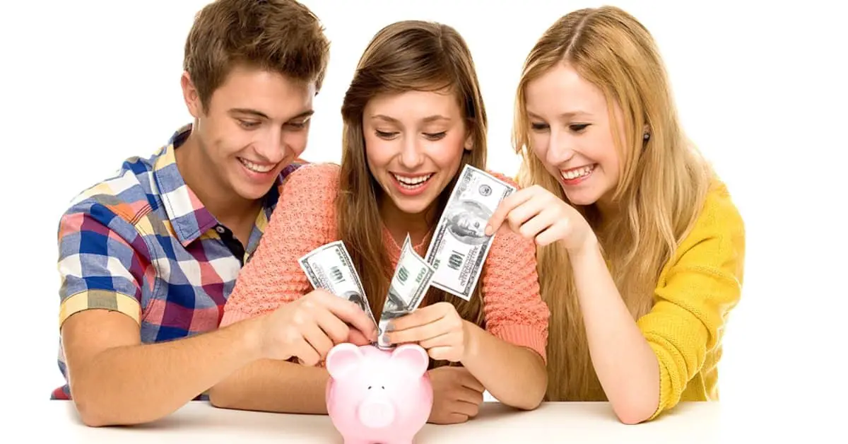 Young people putting money in piggy bank
